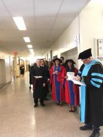 Group of students waiting in a hallway